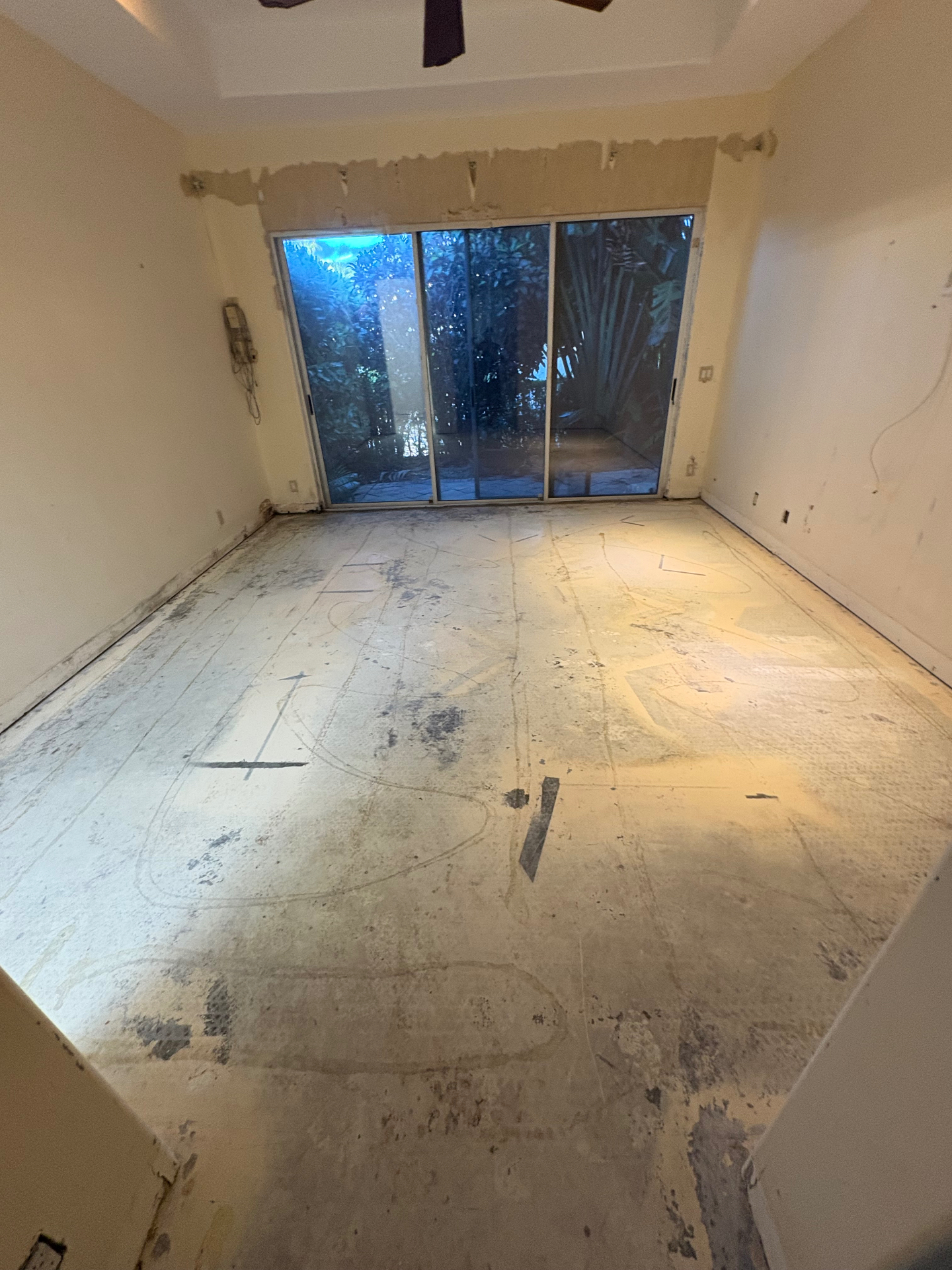 Room cleared of renovation debris with the exposed floor visible